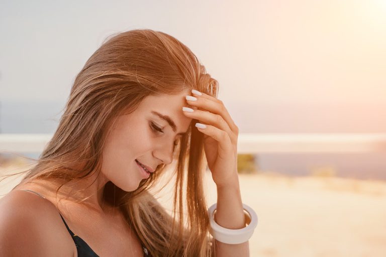 Closeup of a woman holding her head while looking down What is Ectopic Pregnancy