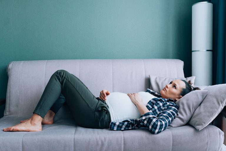 Pregnant woman on couch