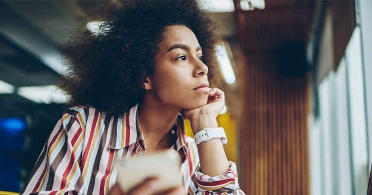 Thoughtful woman considering whether abortion is her only option because of financial concerns.